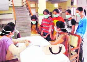 Doctors examine students for H1N1 virus at Civil Hospital in Karnal