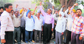 PSEB employees hold a protest in Ludhiana on Thursday.