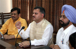 Punjab BJP organising secretary Ajay Jamwal addressing party men at Bathinda on Friday. Party general secretary Kamal Sharma and vice-president Manjeet Singh Rai are also seen in the picture. 