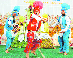 Students perform bhangra at the PTU youth festival in Abhipur on Friday.