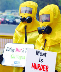 PETA activists protest outside Pragati Maidan in New Delhi on Friday.