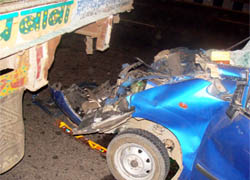 A car hits a stationary truck, killing one and injuring two persons, on NH-8, near Sector-31, in Gurgaon on Thursday night.