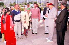 A frequent visitor to Shimla will testify to a usual crowd at the official bunglow of Chief Minister Prem Kumar Dhumal on the Ridge in the morning. Security around the gate has just two or three constables who allow you easy access inside. In the picture Dhumal is personally listening to grievances of a handicapped person and is himself jotting down details to get it redressed.