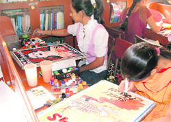 Students take part in a poster-making contest at GTB College, Dakha,
