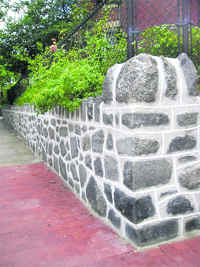 A wall of cut & grouted stone.