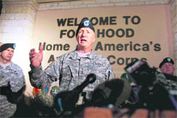 Lt Gen Robert Cone addresses a press conference near the main entrance to the military base at Fort Hood, where Major Nidal Malik Hasan, an army psychiatrist, killed 13 persons and injured 31 on Friday