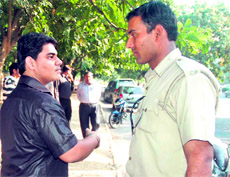 Raghav Mehra, whose Tata Safari hit the scooter of the victims, with a policeman.