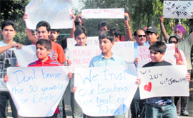 St Johns students take out a rally to extend support to their art teacher in Chandigarh on Saturday.