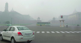 Smog blankets Vijay Chowk in New Delhi on Saturday.