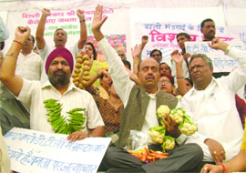BJP leaders shout anti-government slogans at Chandni Chowk in Old Delhi during a protest against rising prices of essential commodities on Saturday.