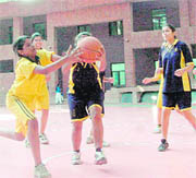 A match in progress at the Council School Girls Basketball Tournament in Dehradun on Saturday. 