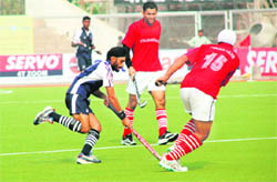 The match between Punjab Police and Corps of Signals in progress at The Olympian Surjit Hockey Stadium in Jalandhar on Saturday