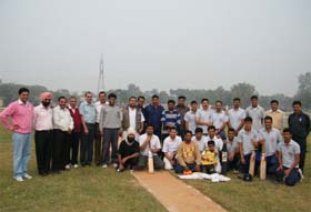 Players of both the teams, the ITBP and the Press Club, pose for a group photograph before the beginning of the match at the ITBP ground in Bathinda