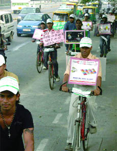 Rashtriya Rajdhani Shetra Tipahiya Chaalak Union members take out a cycle rally at BRT corridor to spread awareness of the problems of autorickshaw drivers and safe driving in New Delhi on Sunday.