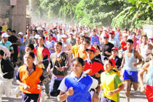 Students participate in a marathon held on the eve of Formation Day of Uttarakhand in Dehradun on Sunday.