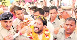 Gopal Kanda, newly-appointed Minister of State, thronged by supporters at Sirsa on Sunday.