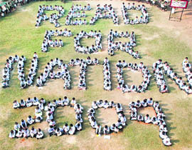 Schoolchildren participate in "Read for Nation 2009" organised nationwide by Scholastic India Ltd to encourage and inculcate the reading habit in students in Gurgaon on Sunday.