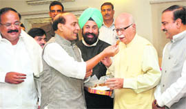 BJP leader LK Advani being offered sweets on his 82rd birthday by party leaders, including Rajnath Singh, Venkaiah Naidu and Ananth Kumar, in New Delhi on Sunday.