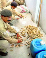 STF and Patna police personnel seize a huge cache of explosives, including 1,000 kg of ammonium nitrate and thousands of bullets, from a locality in Patna on Sunday.