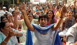 Employees of different state government departments posted in Gurgaon stage a demonstration in front of Gurgaon mini-secretariat on Monday.