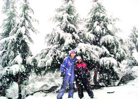 Tourists enjoying in snow near Solang valley, about 11 km from Manali, which experienced early snow-seasons first