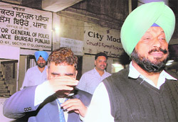 VK Janjua being taken to a hospital from Vigilance Bureau headquarters in Chandigarh on Monday.