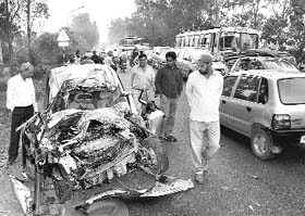 Mangled remains of the ill-fated car which collided with a PRTC bus near Liberty Chowk in Rajpura