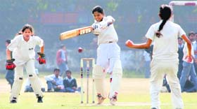 A batswoman plays a shot during a match between Andhra Pradesh and Chandigarh