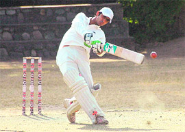 A batsman plays a shot at the Council Inter-School Cricket Tournament being played at St Josephs School in Dehradun on Tuesday.