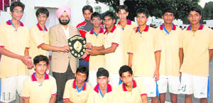 The Doon International School basketball team receives the Inter-School Under-16 Tournament trophy in Dehradun on Tuesday.