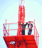 Two Shiksha Acharyas atop the Akashwani tower in Dehradun on Tuesday.