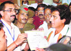 Congress candidate Raj Babbar collects the victory certificate from the election officer in Firozabad on Tuesday.
