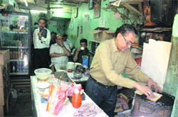 A view of Mulla tea stall where butter toast is prepared on coal, instead of toaster. Over the years, regular visitors to the stall have relished the taste of the toast. 