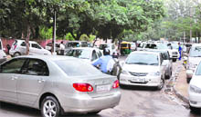 Vehicles scramble for space outside a school in Sector 26, Chandigarh. 