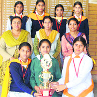 Soccer players with their trophy at Mullanpur Dakha