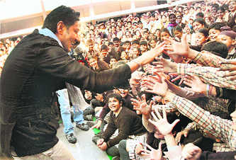 Actor-singer Harbhajan Mann promotes his new Punjabi movie, "Heer Ranjha," at a school in Amritsar on Wednesday.