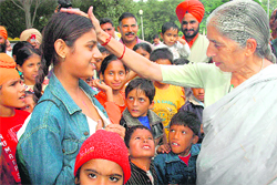 Punjab Health Minister Laxmi Kanta Chawla gives her blessings to children who have been operated upon for heart ailments, in Chandigarh 