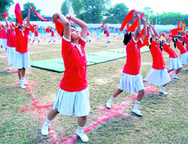 Students perform a drill at the annual athletic meet of Cambrian Hall School in Dehradun on Thursday