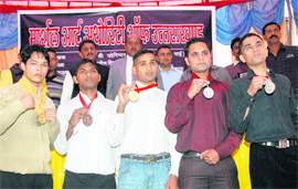 The martial arts winning team being honoured in Dehradun on Friday.