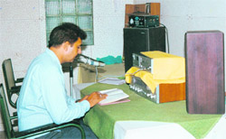 An anchor in the recording room of the National Institute of Visually Handicapped, Dehradun.