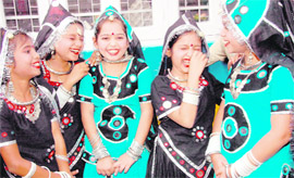 These girls are all giggles before the start of their performance at the annual day function of their school in Dehradun.