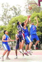 Players in action at the Council School Senior Boys Basketball Tournament in Dehradun on Friday.