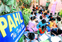 Slum children attend an evening school run by a retired SP in Jammu.
