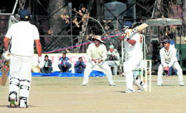 A cricket match between Haryana and Jammu and Kashmir team in progress at the