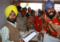 Farmers in a verbal duel with the employees of Punseed, a seed counter at the grain market, in Bathinda on Saturday.