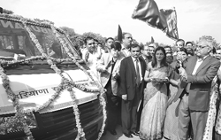 Haryana Chief Minister Bhupinder Singh Hooda flags off a fleet of ambulances in Panchkula