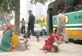 Streetchildren perform acrobatics on the occasion of Children's Day in New Delhi