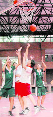 A match in progress at the District Youth Basketball Championship for Girls in Dehradun on Saturday