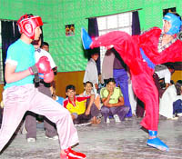 Players in action at the National Kickboxing Championship in Dehradun on Saturday