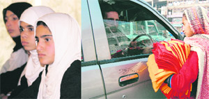 Schoolchildren listen to Education Minister Peerzada Mohammad Sayeed during a Childrens Day function in Srinagar on Saturday; and (right) a girl sells dusters to a motorist.